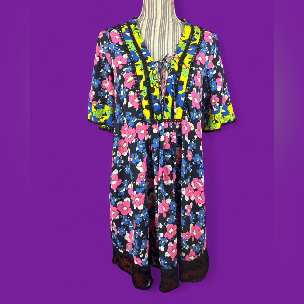 Brightly colored top shop retro inspired mini dress with sexy lace up detail